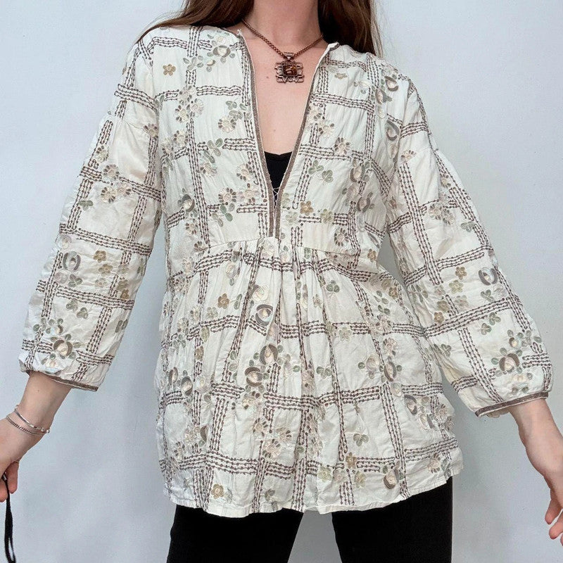 white embroidered flared puff sleeve shirt
