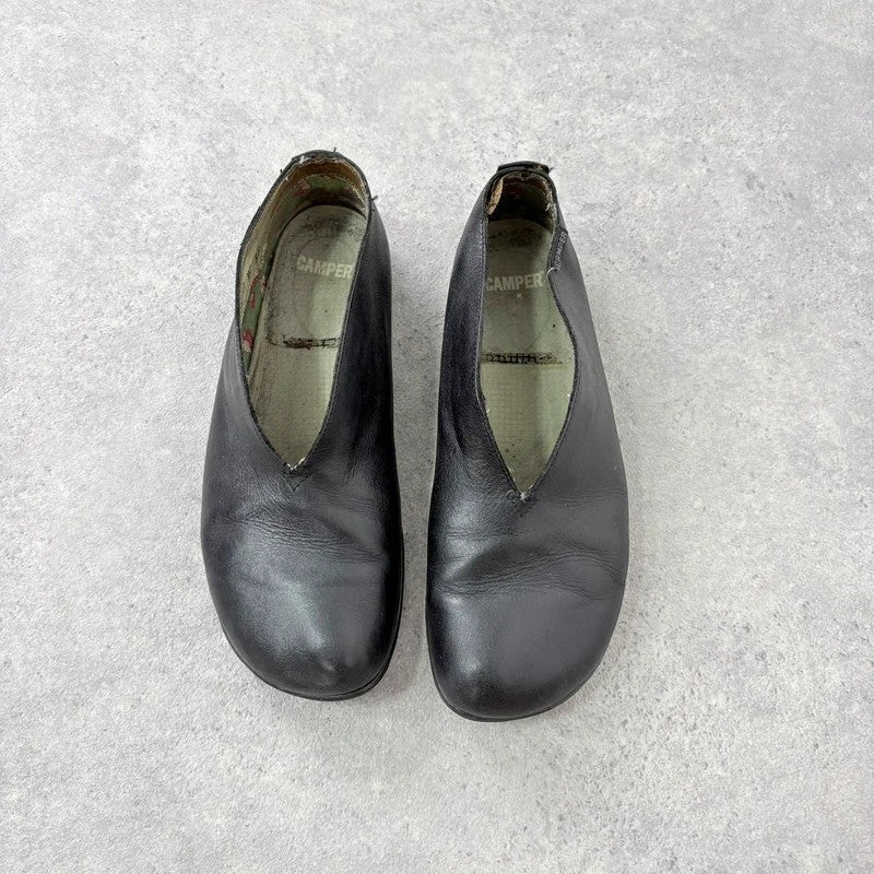 Black leather camper ballet flats