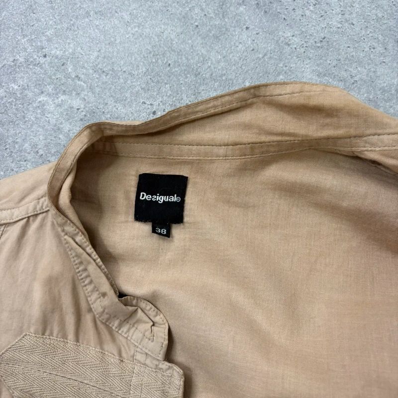 tan fitted panelled military jacket