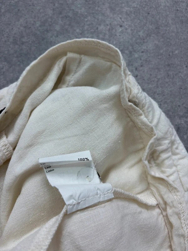 white linen flared utility button trousers