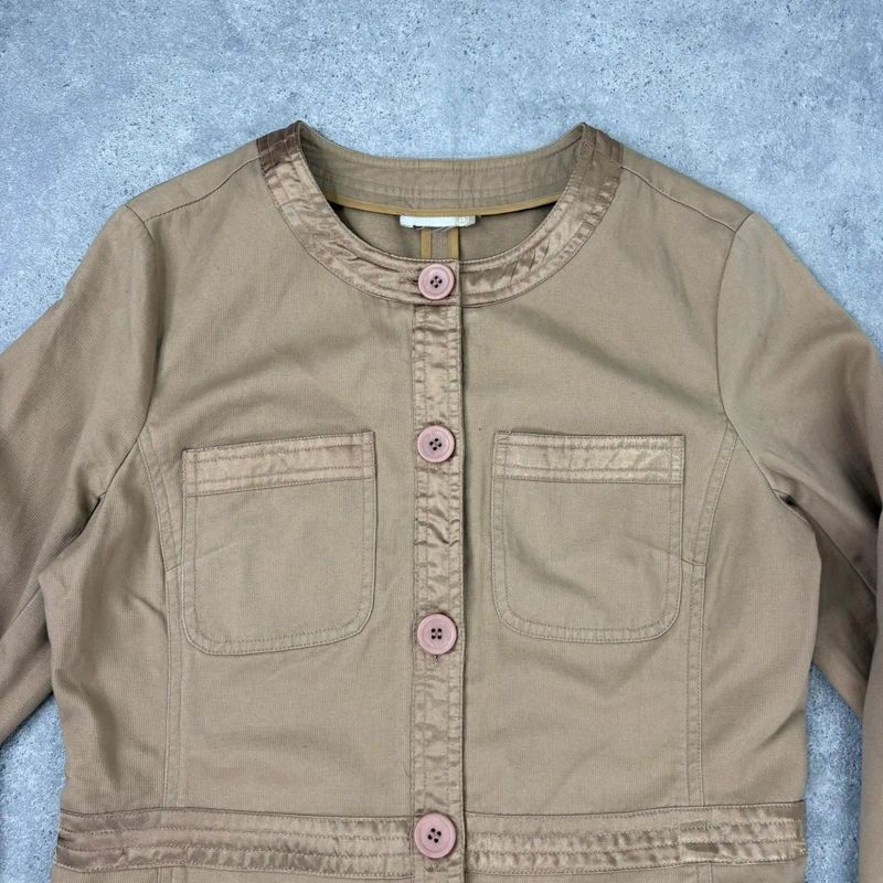 tan boxy cropped fit jacket with exposed button detail