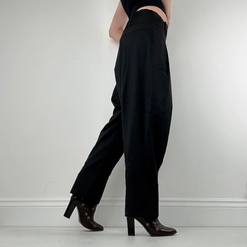 pleated black tailored trousers
