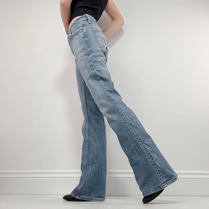 distressed flared leg low rise jeans
