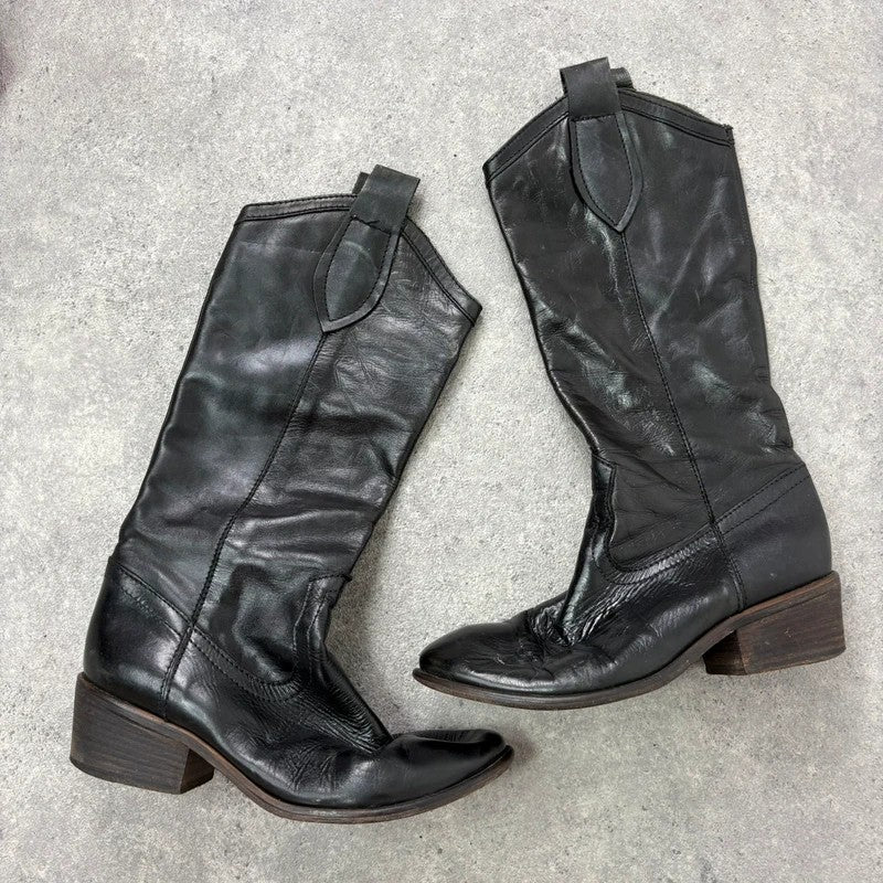 Black leather pointed toe boots