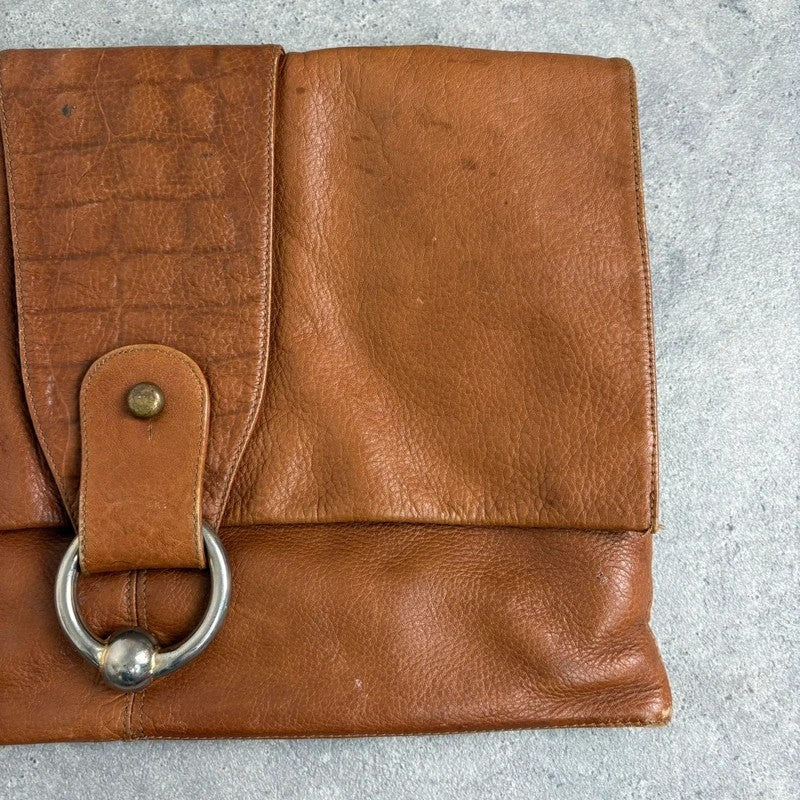 tan lather piercing punky silver hardware clutch bag
