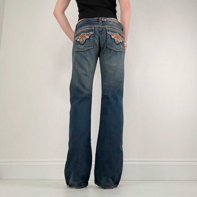 distressed denim low rise flared jeans