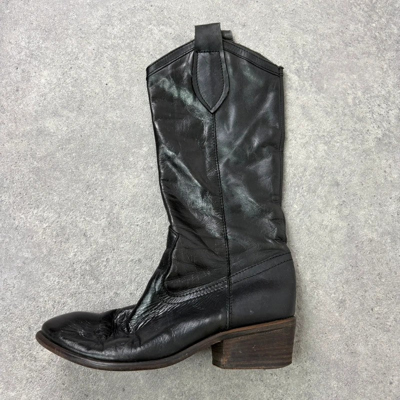 Black leather pointed toe boots