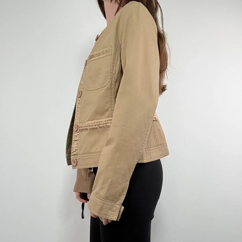 tan boxy cropped fit jacket with exposed button detail