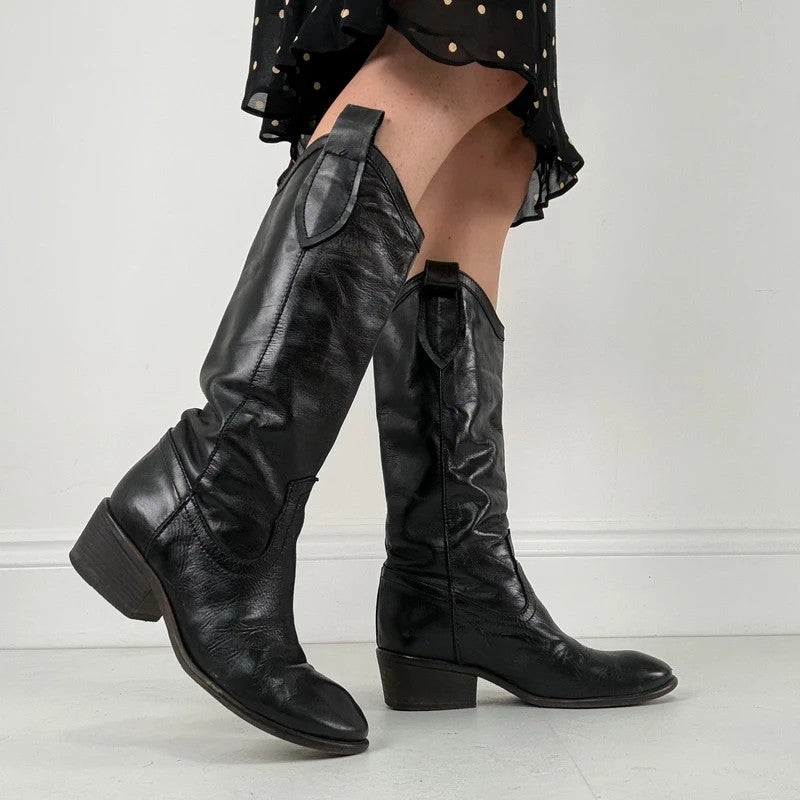Black leather pointed toe boots