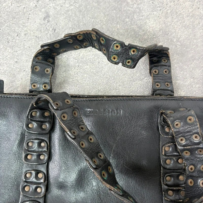 Black mini handbag with studded patchwork handle.