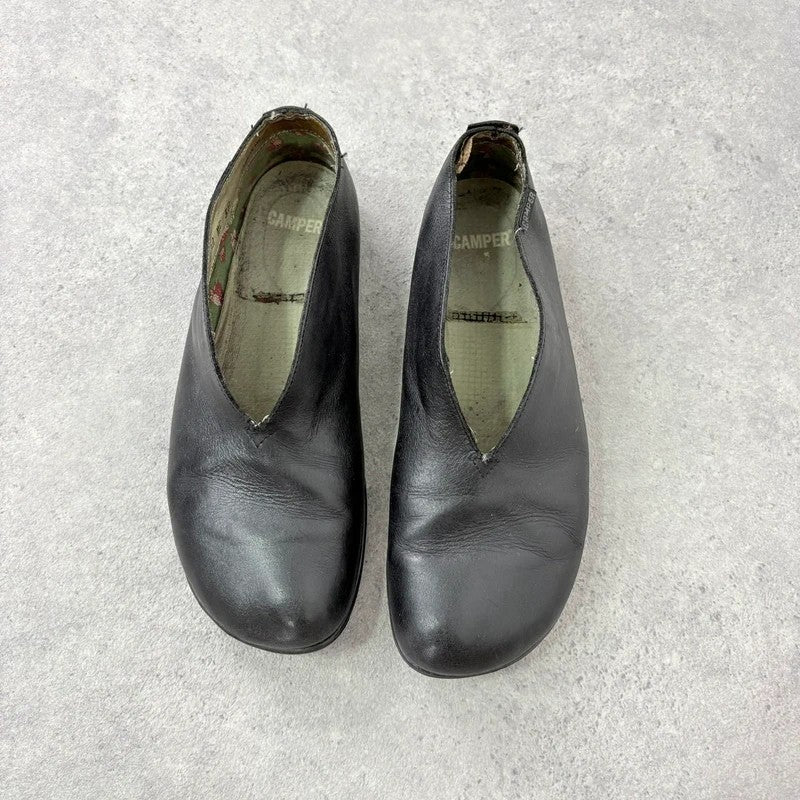 Black leather camper ballet flats