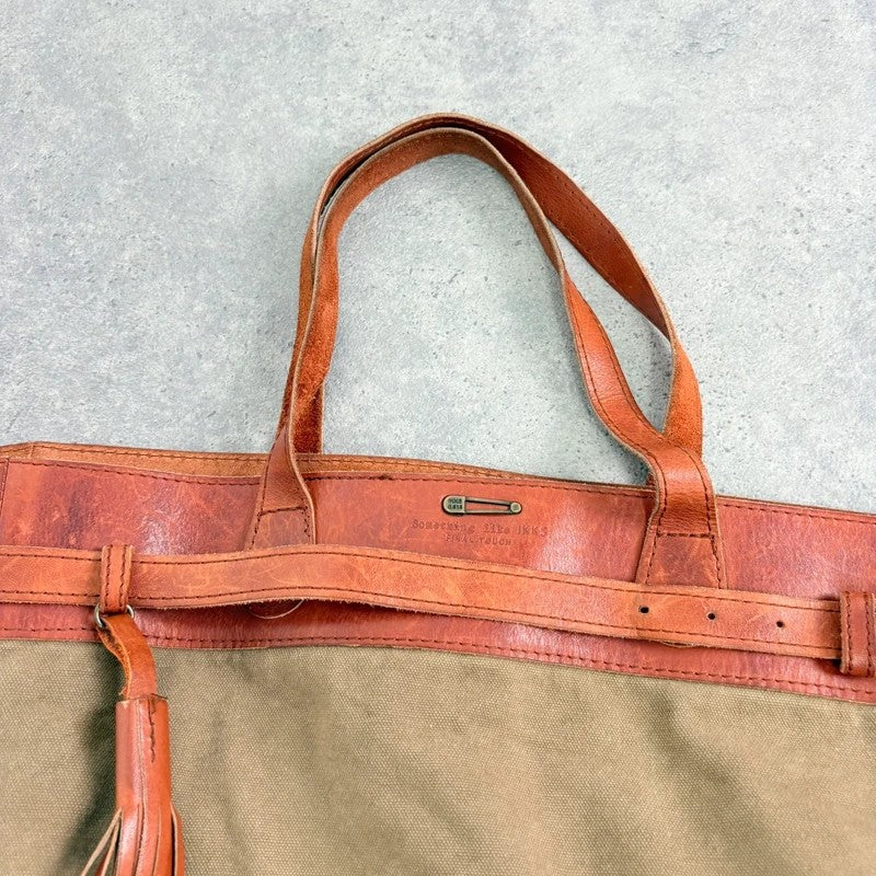 Slouchy oversized leather and canvas shoulder bag