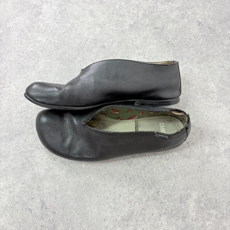 Black leather camper ballet flats