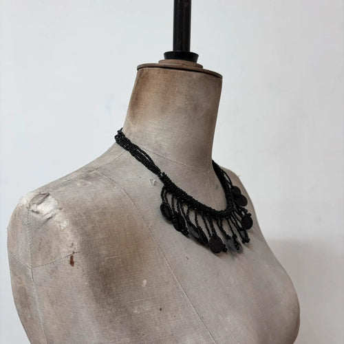 black beaded drape