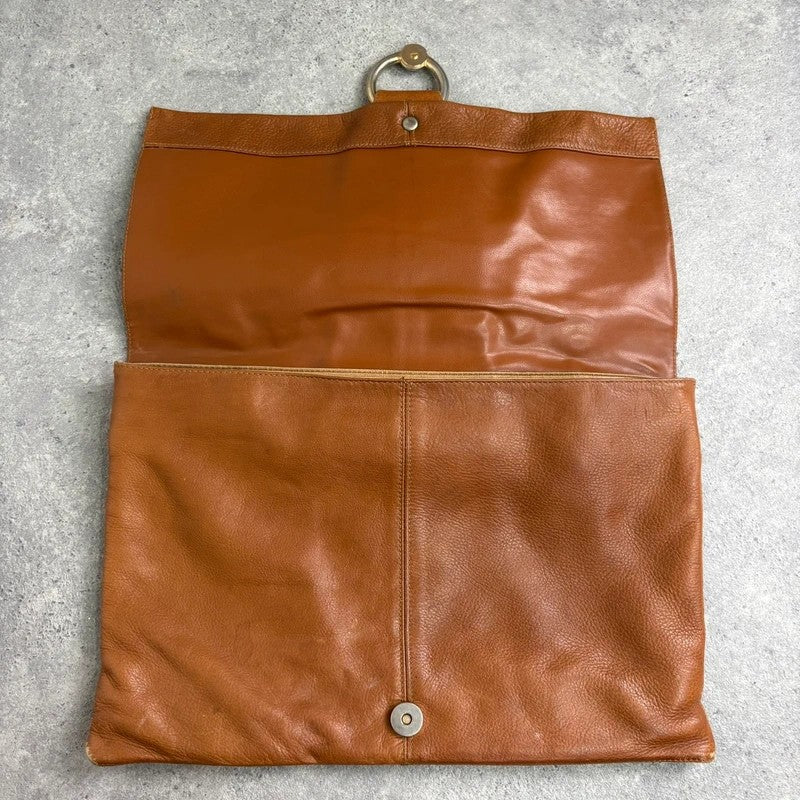tan lather piercing punky silver hardware clutch bag