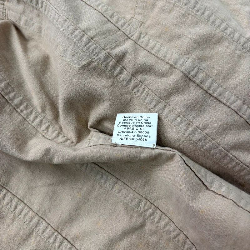 tan fitted panelled military jacket