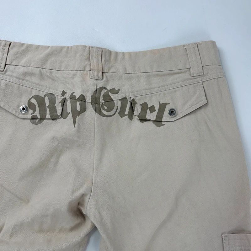 tan canvas wide leg spellout rip curl surfer pants