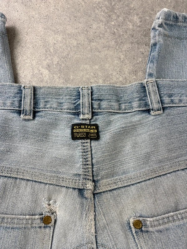 distressed light wash G-star raw cargo flare jeans