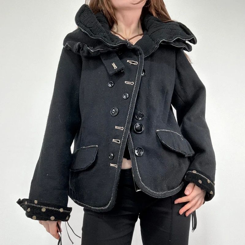 black structured asymmetric polkadot coat