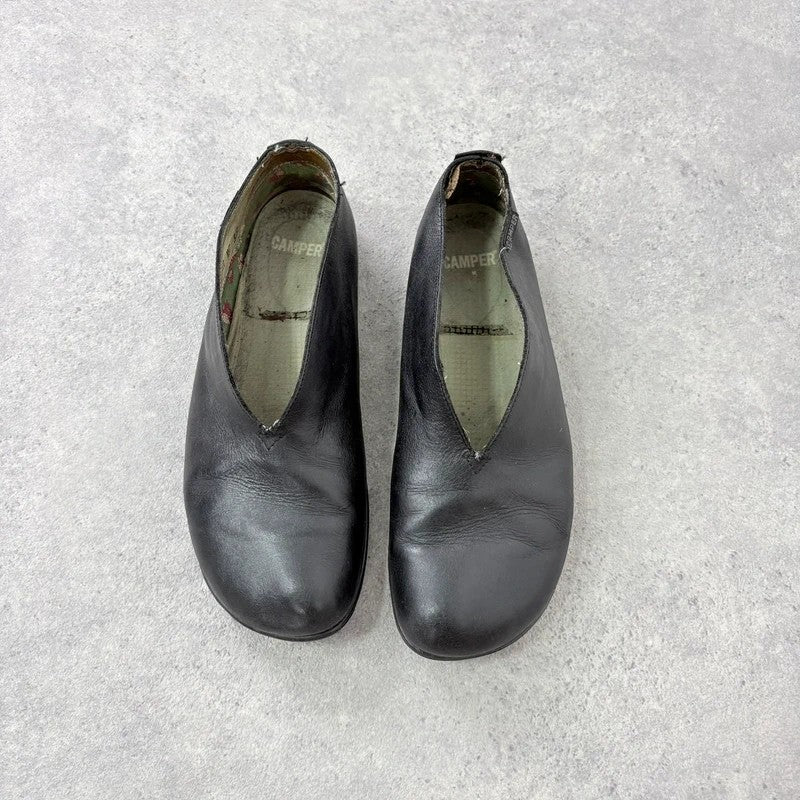 Black leather camper ballet flats
