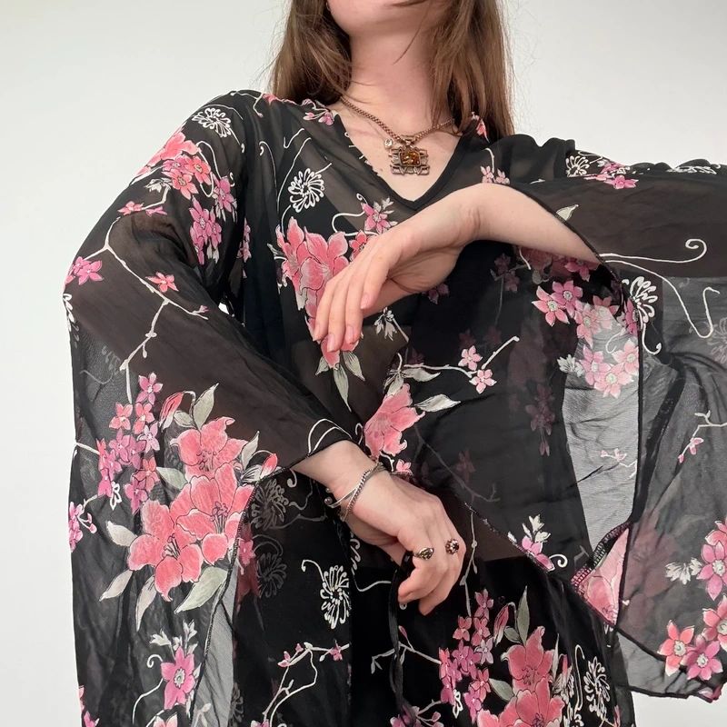 Sheer Black Asymmetric Flutter Blouse