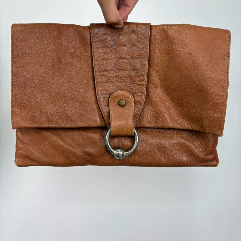 tan lather piercing punky silver hardware clutch bag