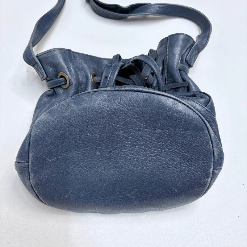 navy blue tassle bucket bag