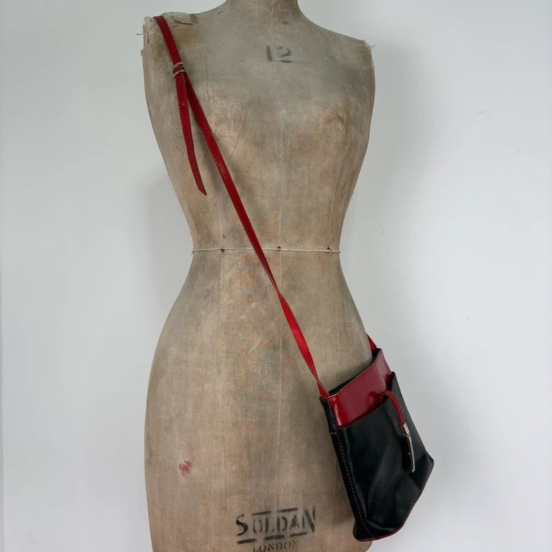 Black and red leather patient mini messenger bag
