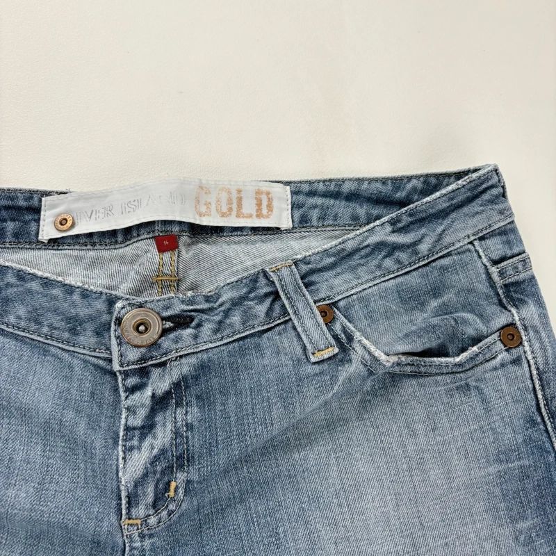 distressed flared leg low rise jeans