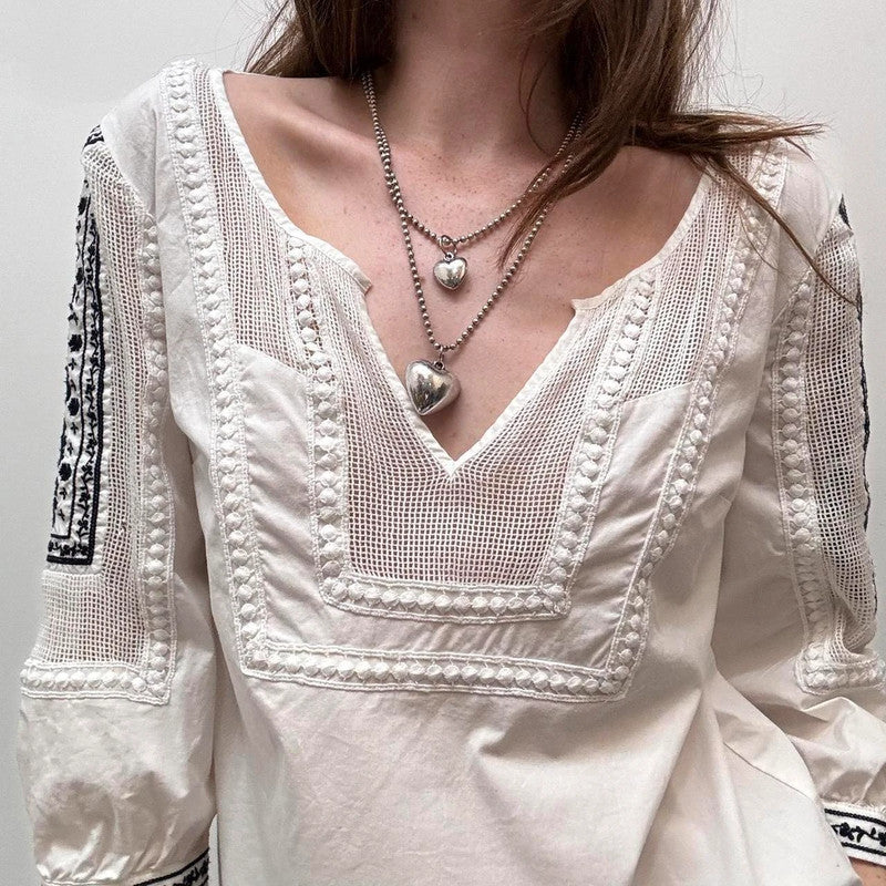 white crochet shirt with navy embroidery