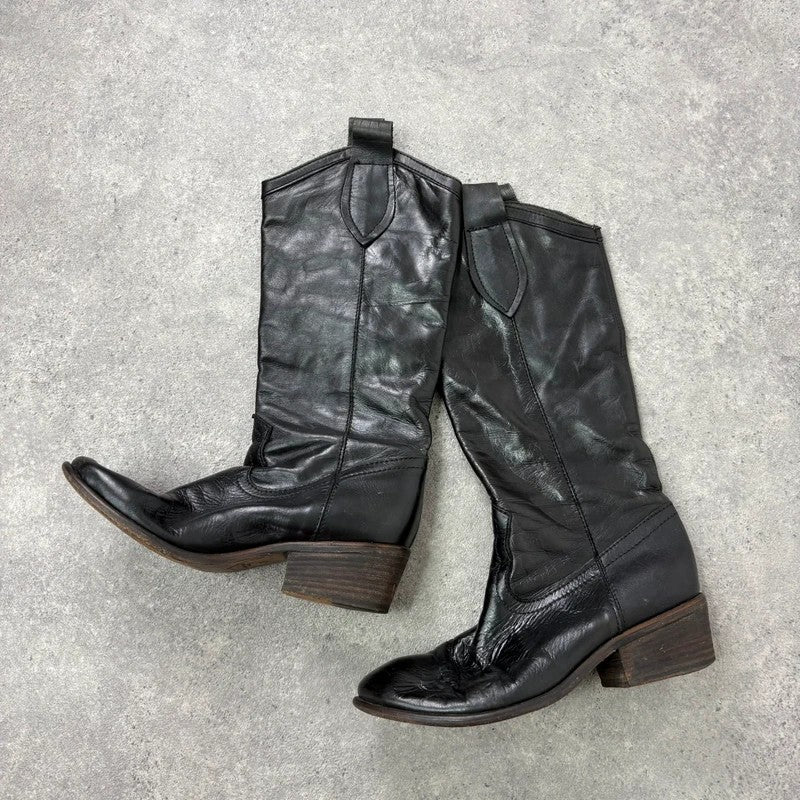 Black leather pointed toe boots