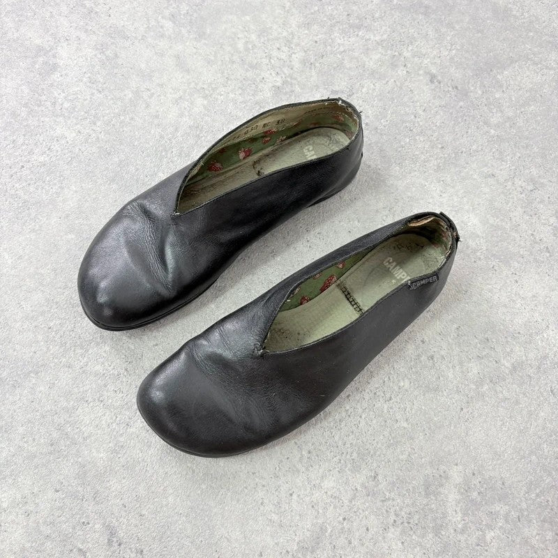 Black leather camper ballet flats