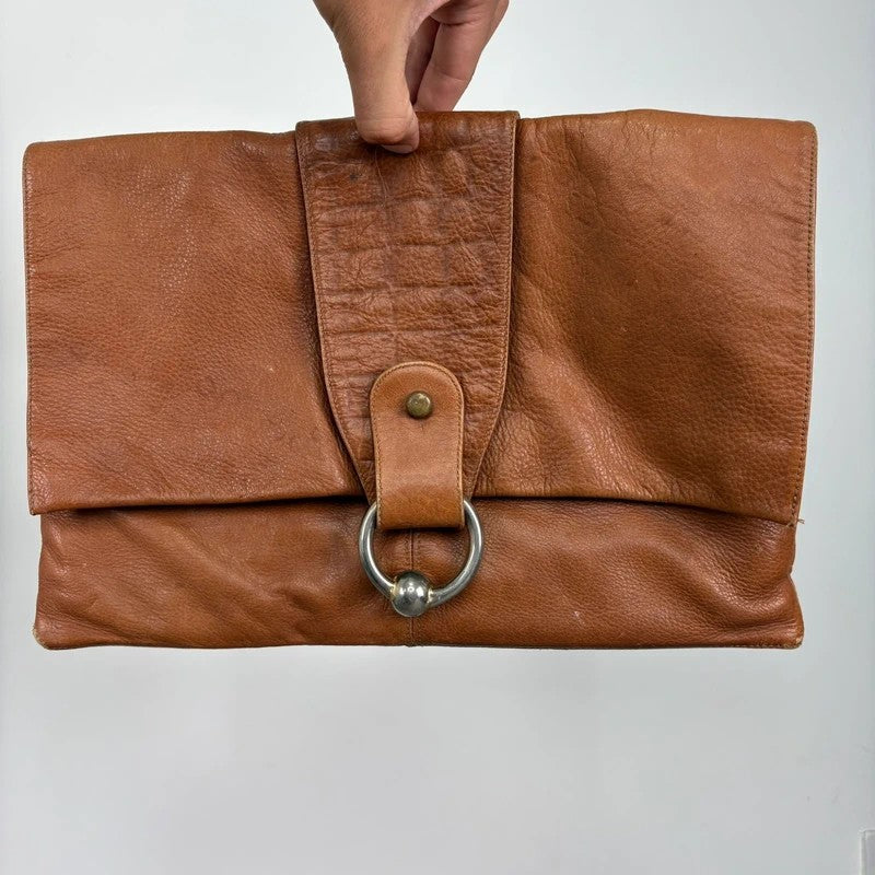 tan lather piercing punky silver hardware clutch bag