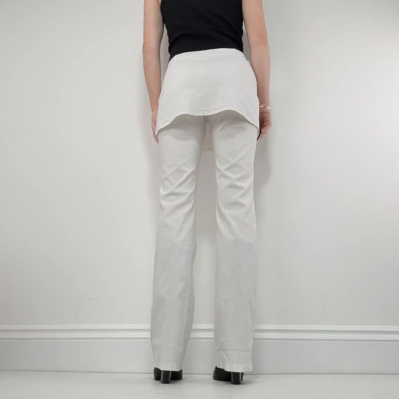 Layered flared trousers with mini skirt overlay