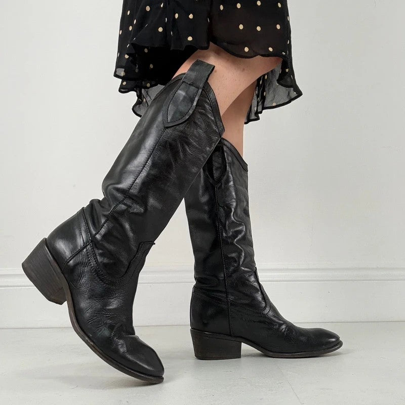 Black leather pointed toe boots