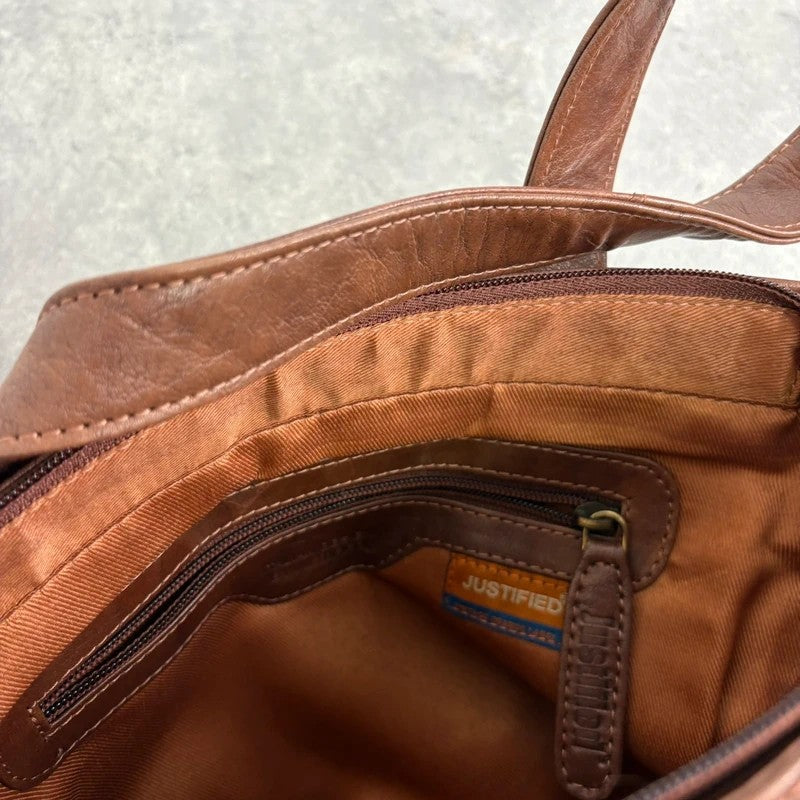 Distressed vintage brown leather handbag