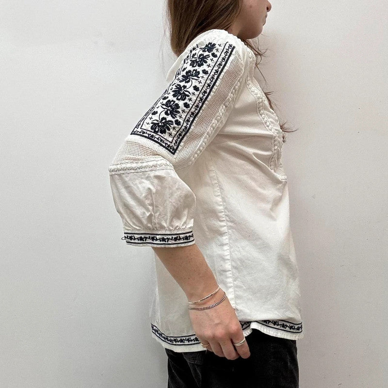 white crochet shirt with navy embroidery