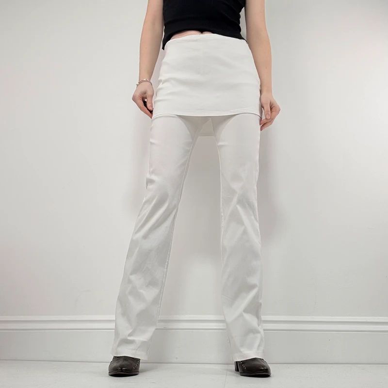 Layered flared trousers with mini skirt overlay
