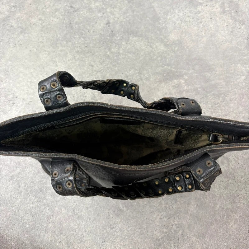 Black mini handbag with studded patchwork handle.