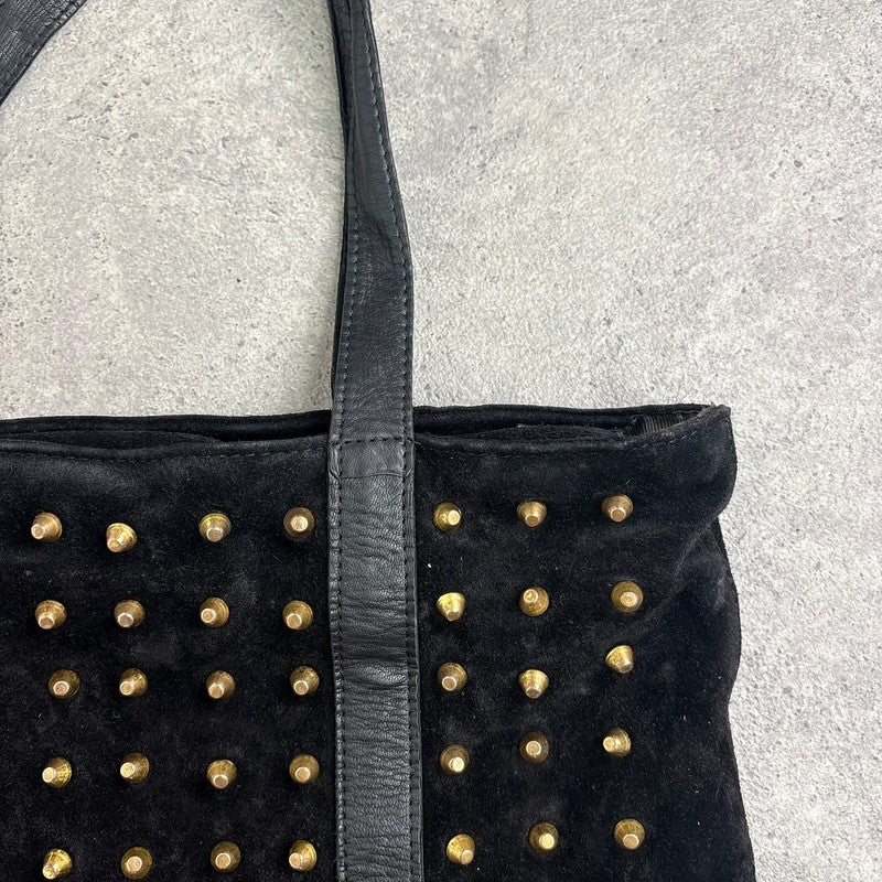 Black suede tote bag with gold studded spikes