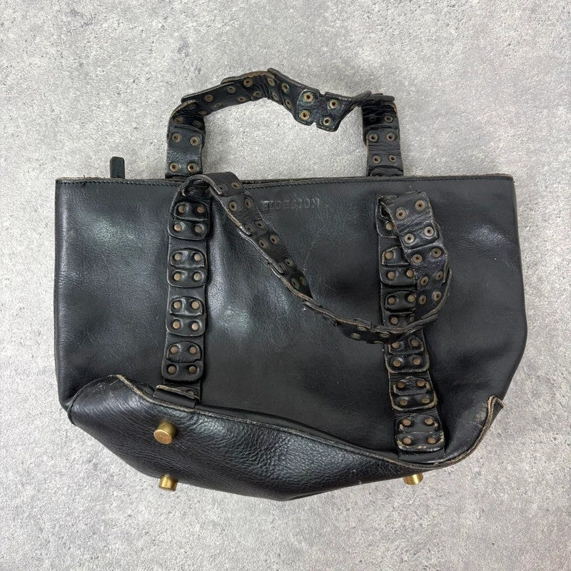 Black mini handbag with studded patchwork handle.