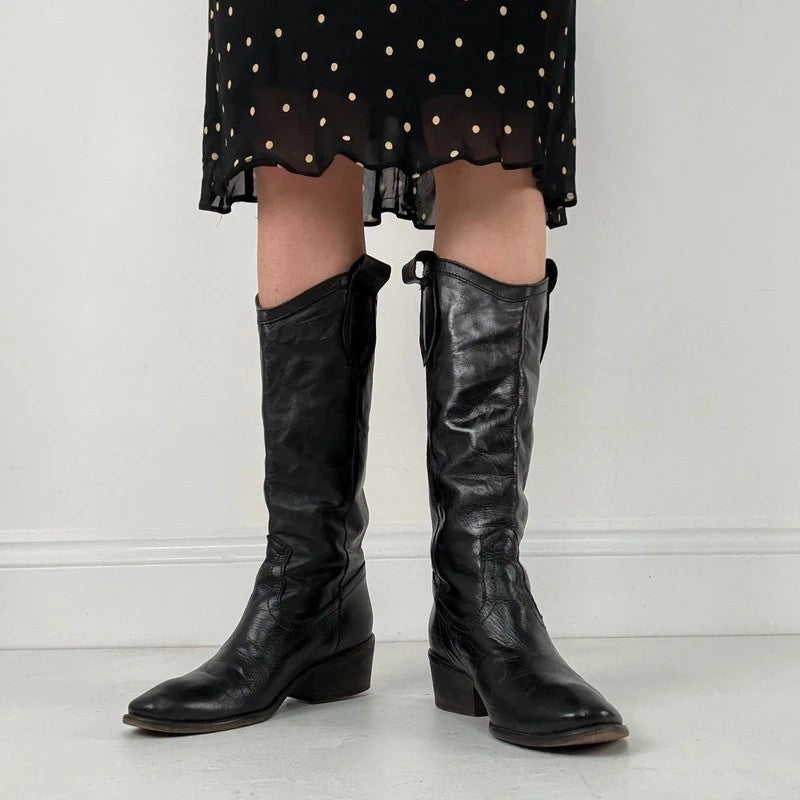 Black leather pointed toe boots