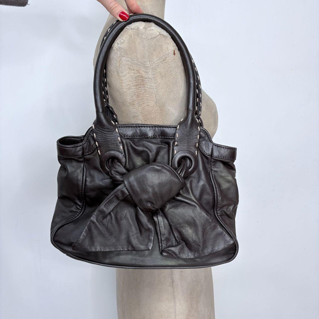 Brown leather bow bag