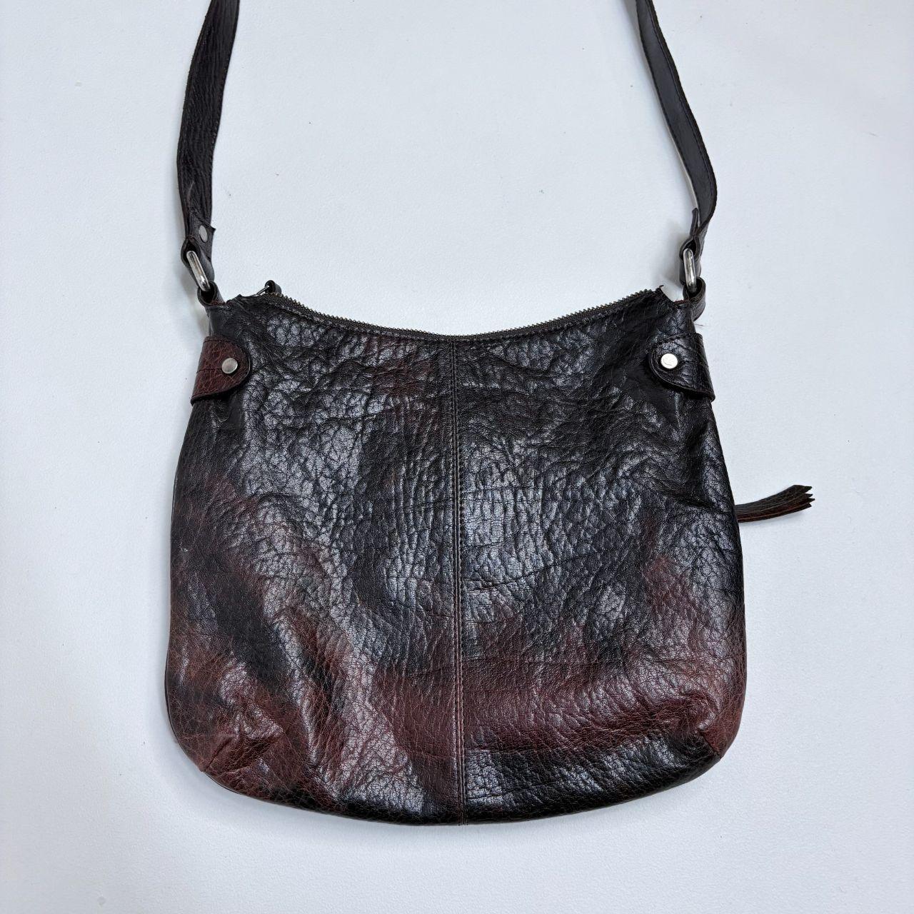 Distressed brown leather buckle studded bag
