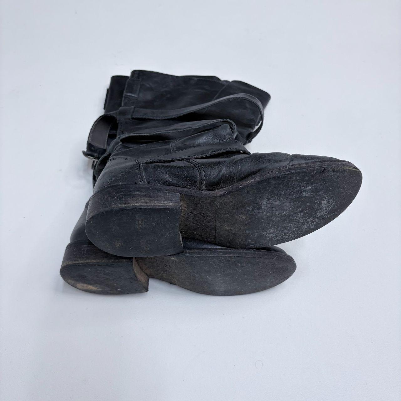 Black leather buckle boots