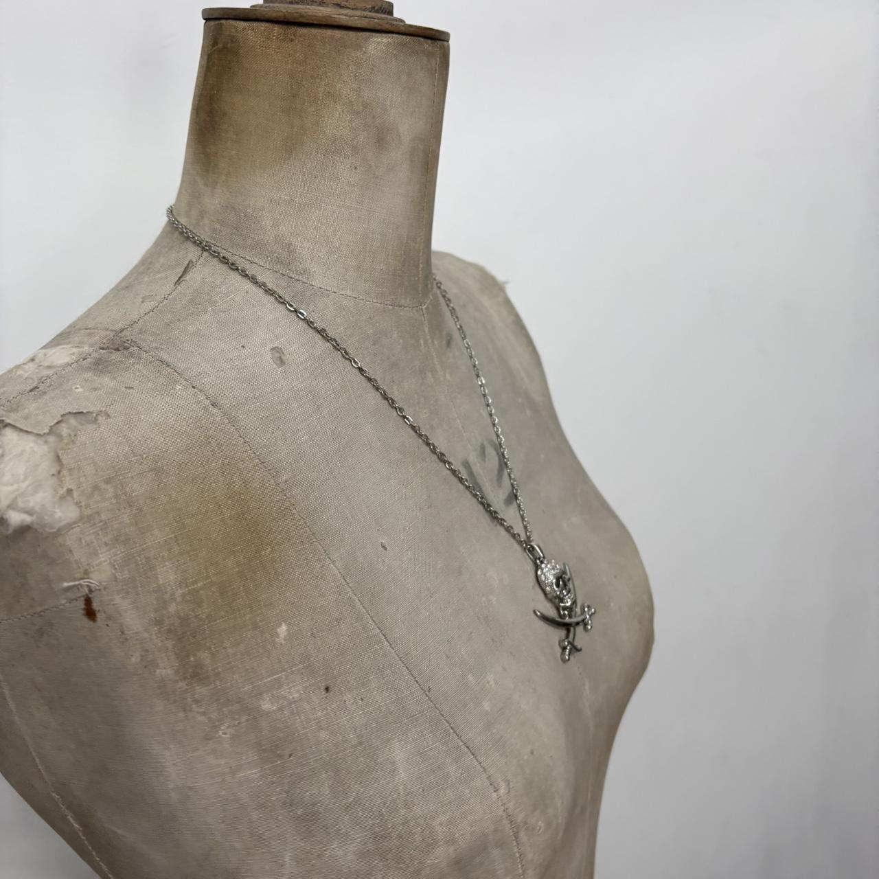 Silver skull and cross bone necklace