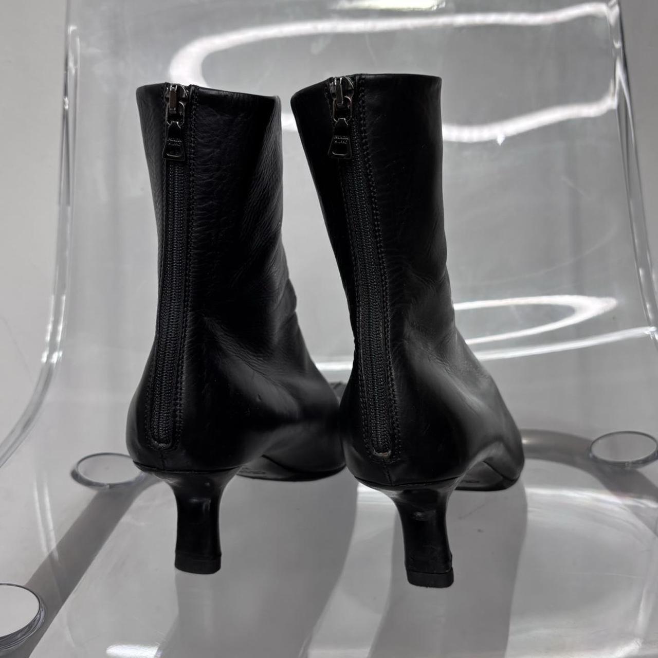 Black pointed heel Prada boots