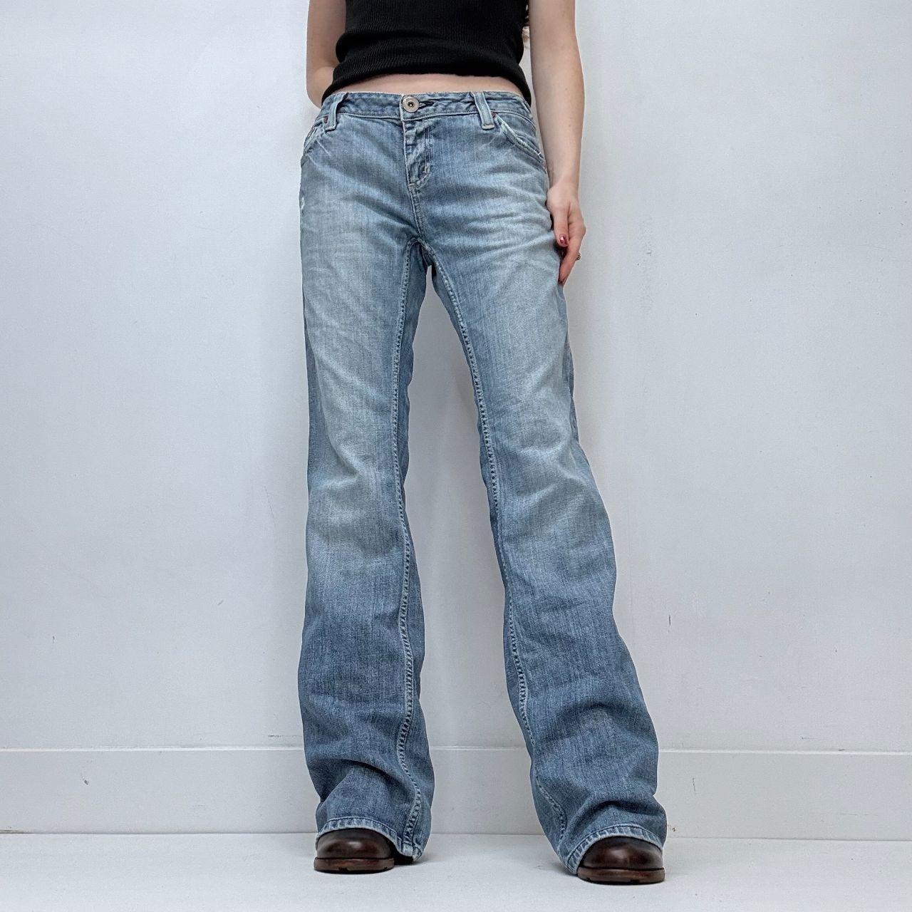 Distressed flared leg low rise jeans