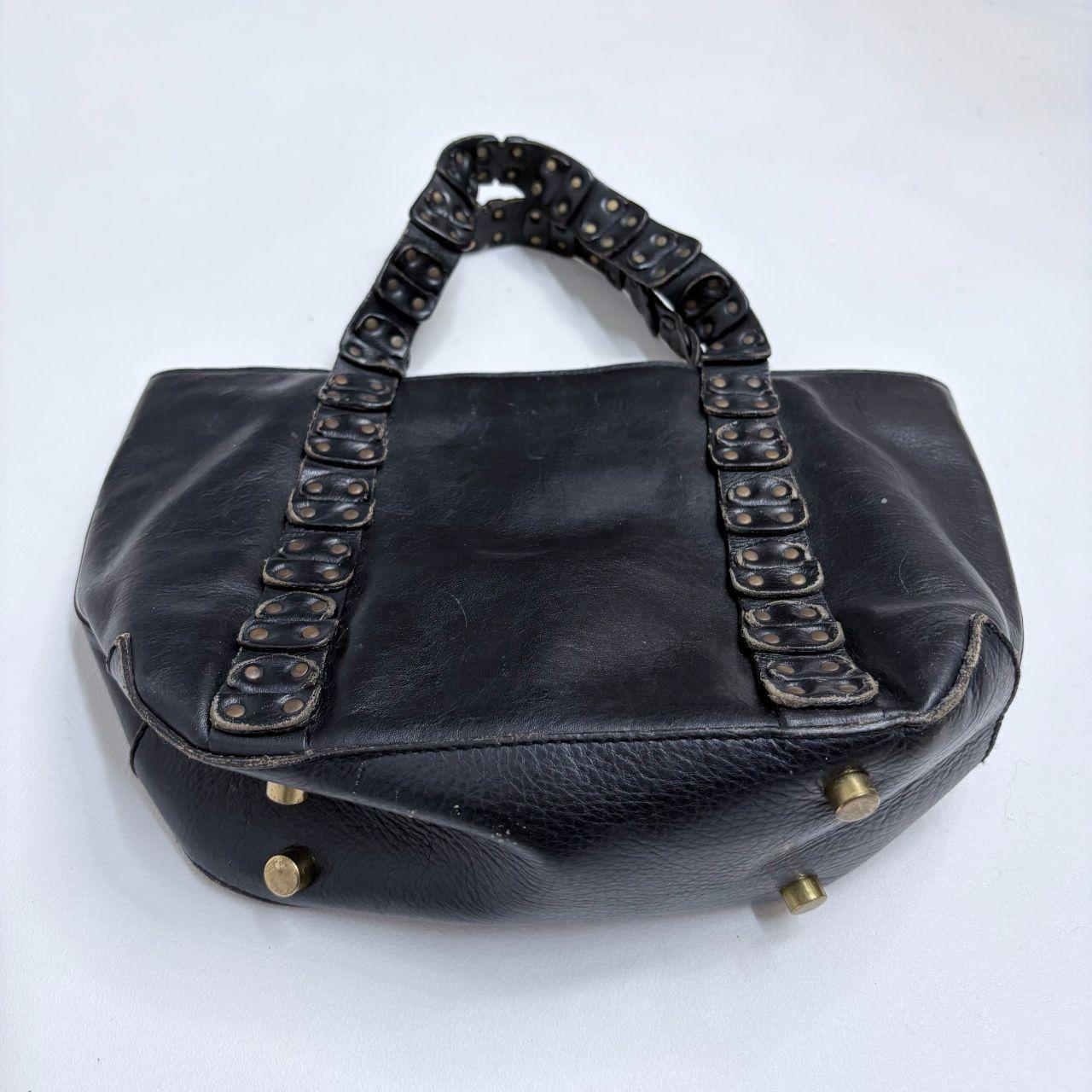 Black leather studded eyelet bag