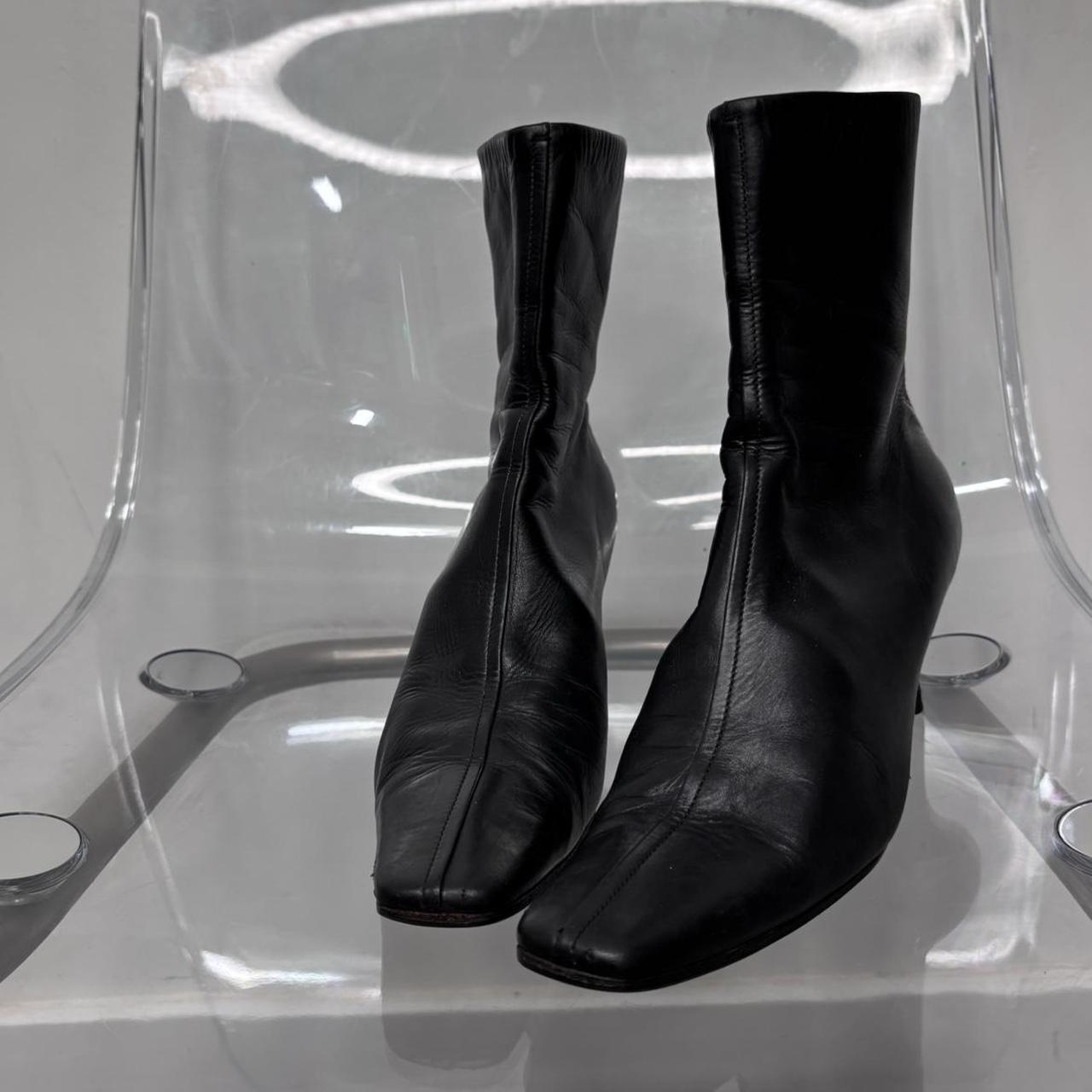 Black pointed heel Prada boots